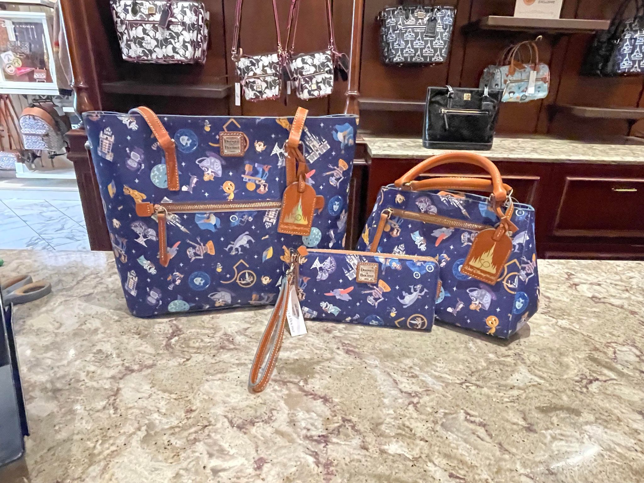 NEW! 50th Anniversary Dooney & Bourke Bags NOW at Uptown Jewelers in Magic  Kingdom - MickeyBlog.com