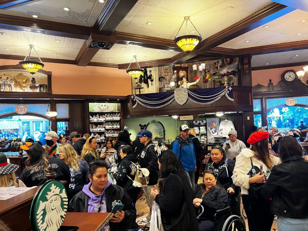 Crowds Swarm Disneyland Emporium for 100th Merchandise