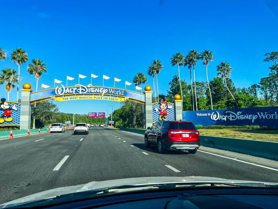 50th banners gone walt disney world entrance sign most magical place on earth road driving