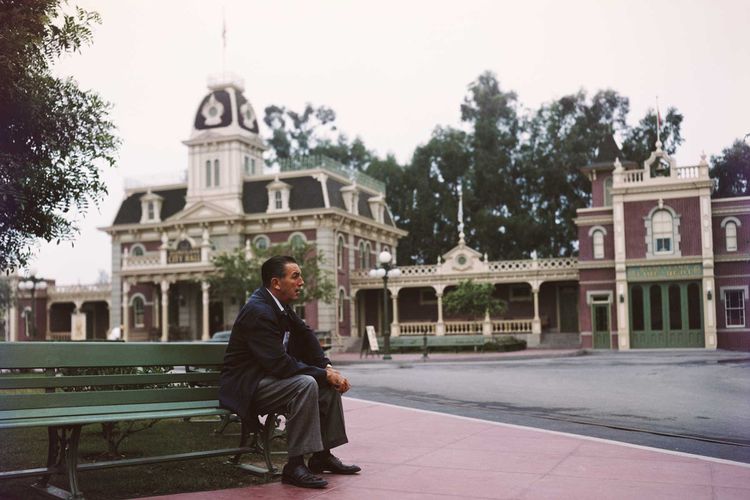 Walt sitting on park bench in Disneyland