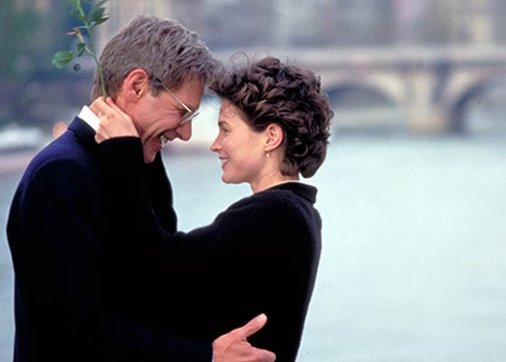 Julia Ormond and Harrison Ford gazing into each other's eyes in Sabrina