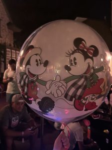Kid Floats Away at Disney World holding Mickey Balloons