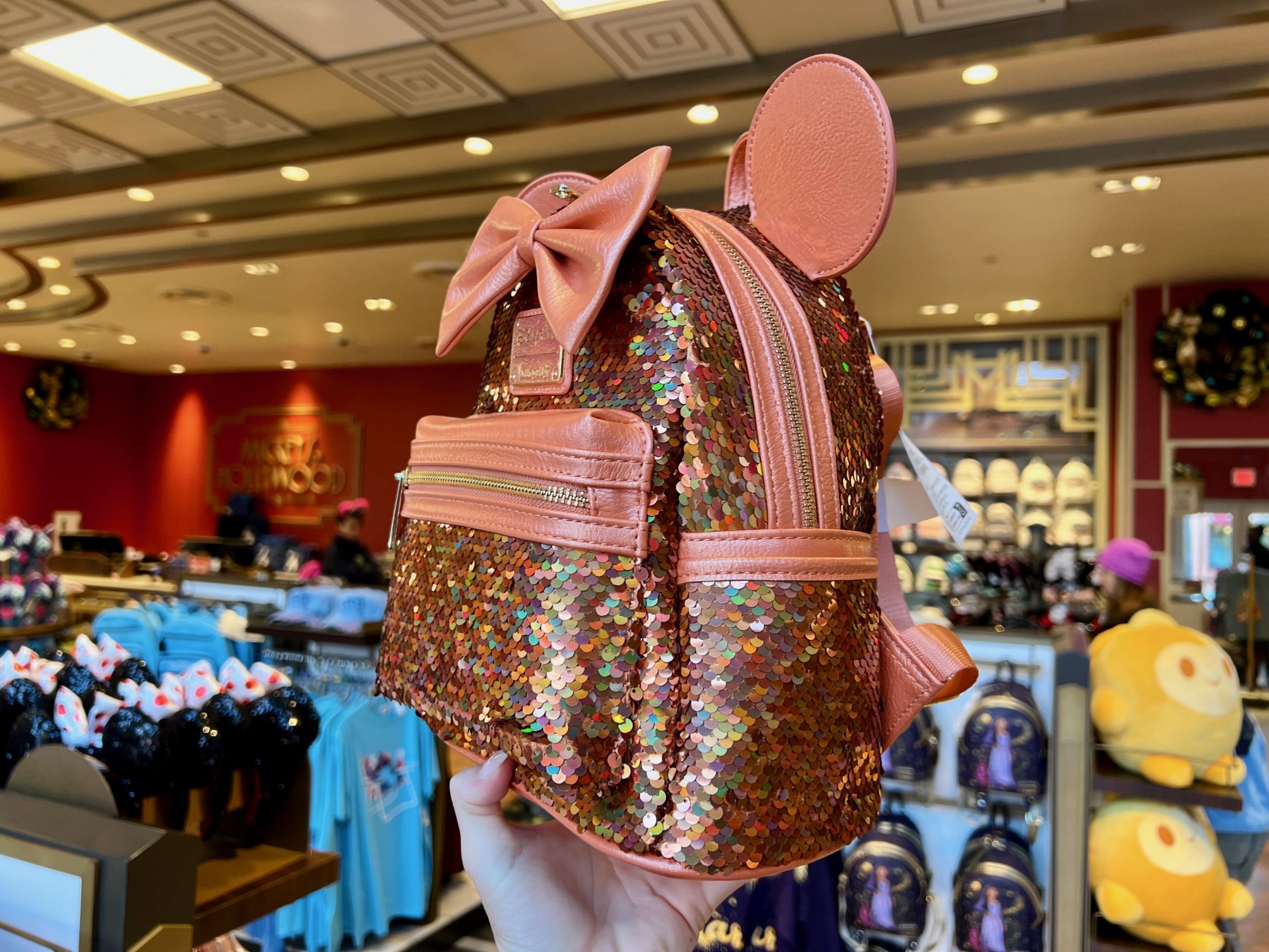 Peach Sequined Loungefly mini backpack side view